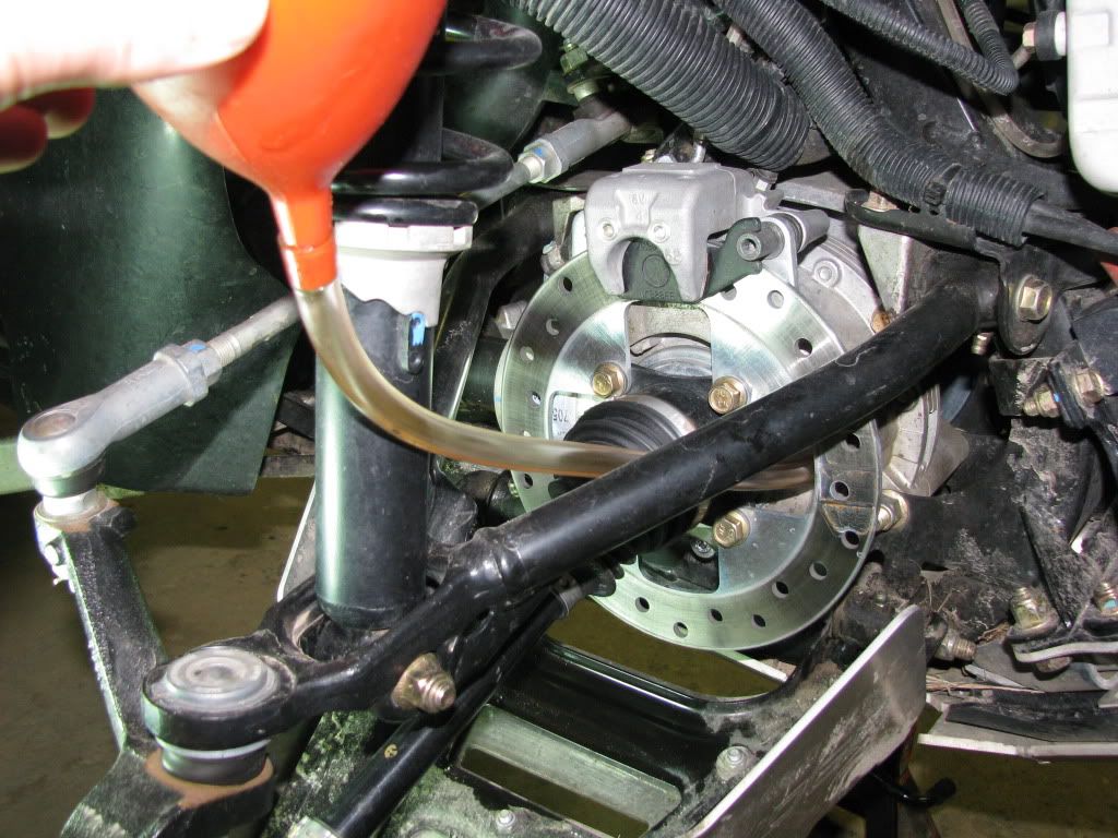 Changing the diff fluid is fairly easy...as you can see from the pics, the drain (small) and fill (large) plugs. I just used a funnel with about 18 inches ...